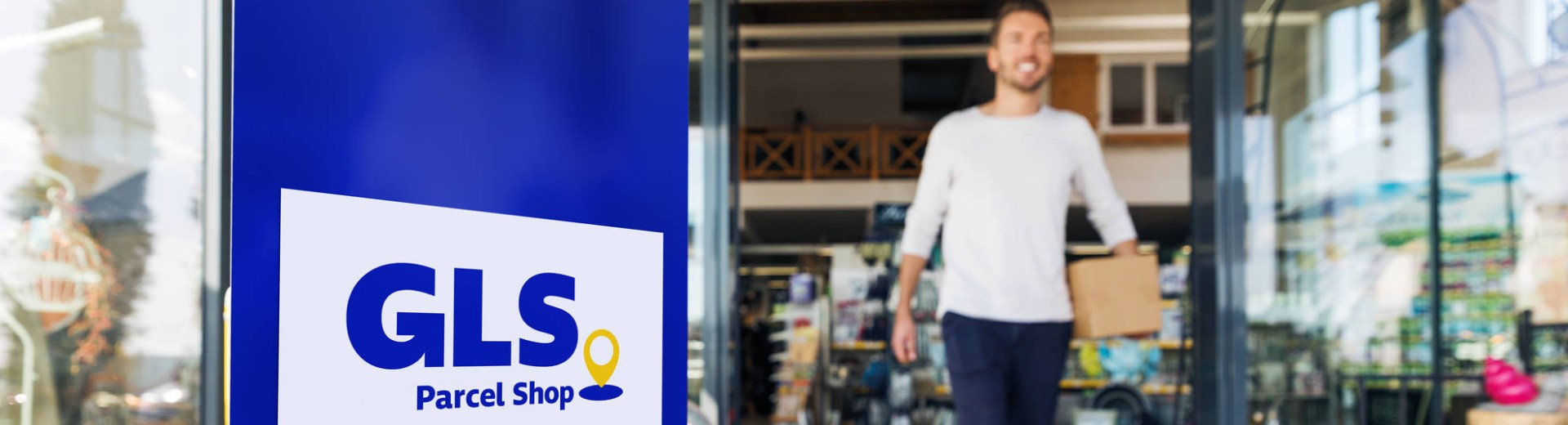 Man leaving a GLS Parcel shop
