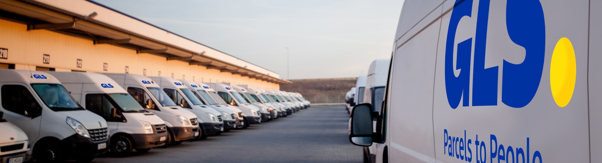 GLS delivery vehicles along the gates