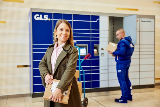 A woman and a delivery driver at a ParcelBox
