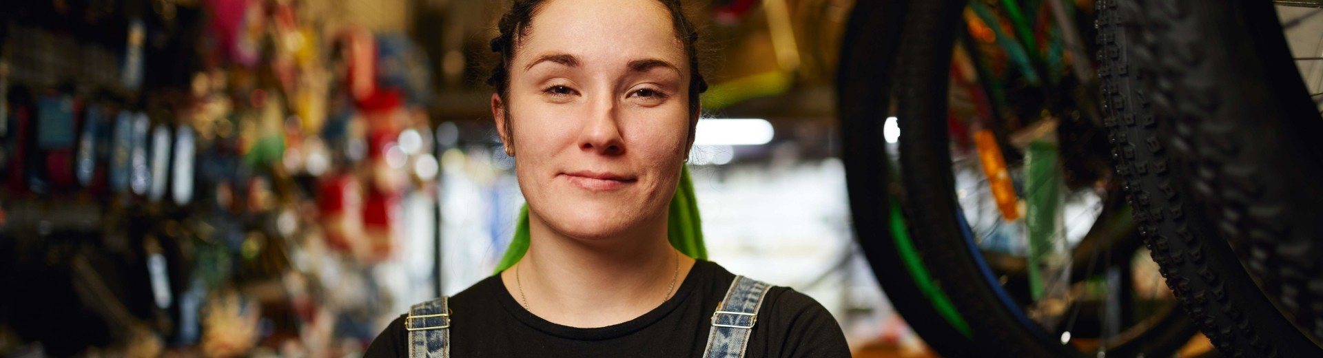 Happy_female_millennial_standing_in_gls_store